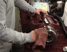 Vacuum repair technician cleaning and servicing a vacuum motor in Chattanooga, TN
